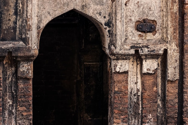 Entry door of an old damaged haunted building