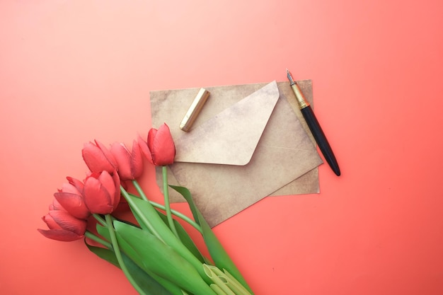 Envelope red tulip empty paper and fountain pen