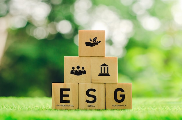 Environmental conservation and sustainable modernization of ESG using renewable resource technologies to reduce pollution. icon on wooden block green background