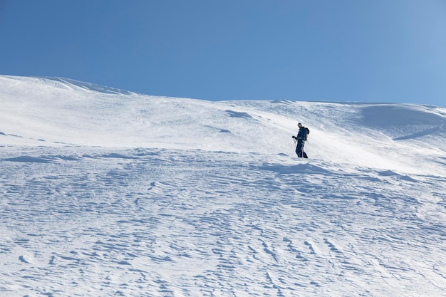 Epic scene of man at the summit of mountain as symbol of life success