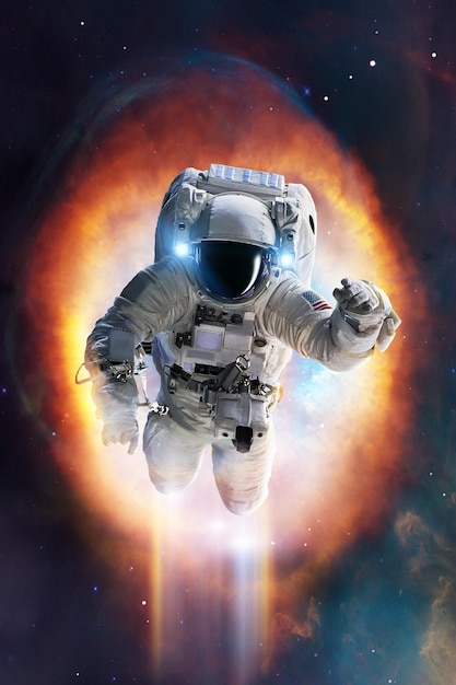 Epic view of an astronaut in spacesuit in space with stars nebula and galaxy around him Elements of this image furnished by NASA