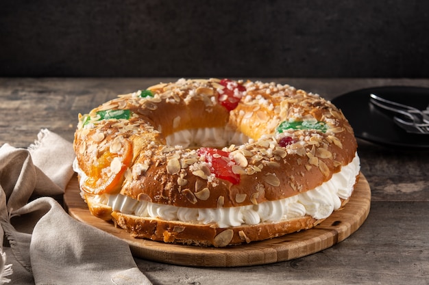 Epiphany cake "Roscon de Reyes" on wooden table