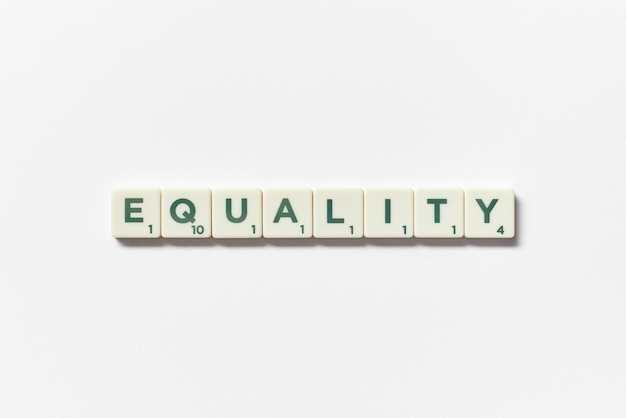 Equality formed of scrabble blocks on white background