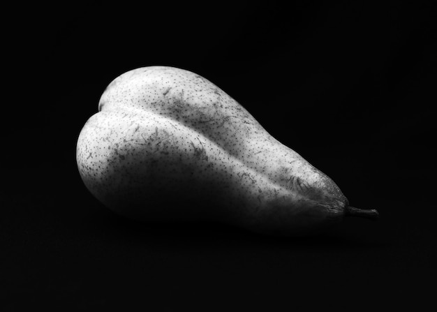 Erotic pear on a black background