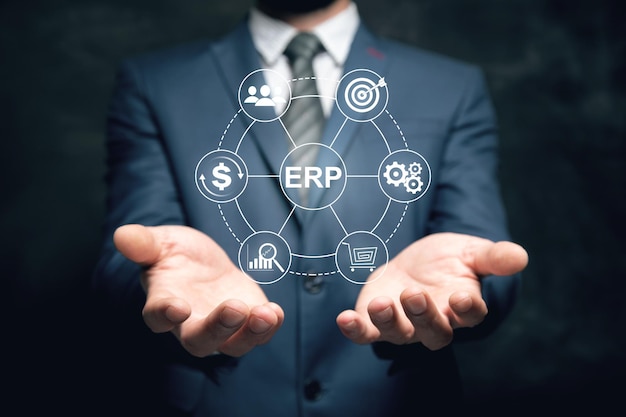 ERP Enterprise resources planning system software business technology Man holding in his hand