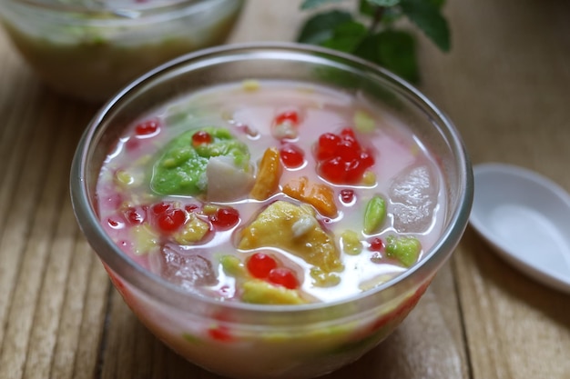 Es Campur or es teler Icy Asian dessert of red ruby pearls avocado young coconut and jackfruits