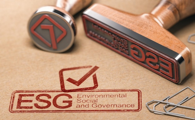 ESG Environmental Social and Governance printed in blue with two rubber stamps over brown paper Corporate responsibility concept