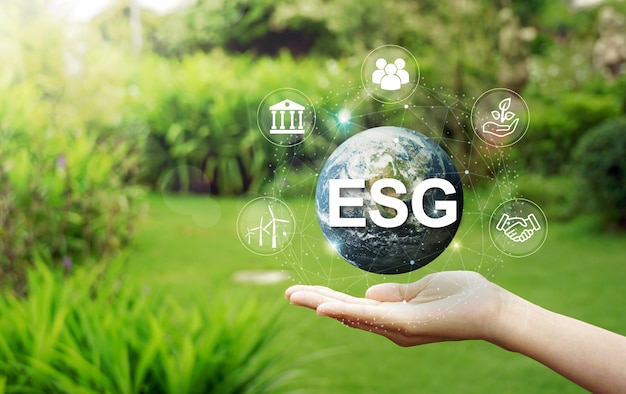 ESG icon concept circulating in hands for society, environment and governance. ESG.