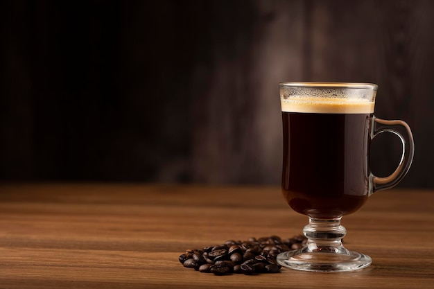 Espresso and coffee beans on the table