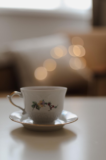 Espresso coffee cup on white table by bokeh light background leisure lifestyle concept soft focus vi