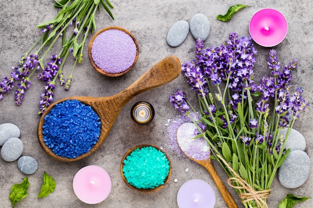 Essential lavender salt with flowers top view.