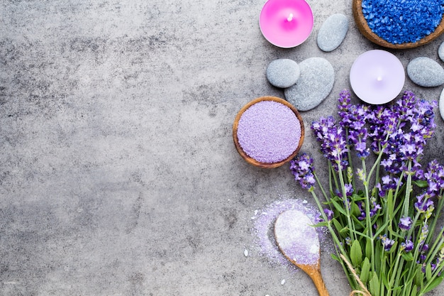 Essential lavender salt with flowers top view.