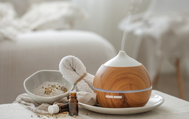 Essential oil aroma diffuser humidifier diffusing water articles in the air.