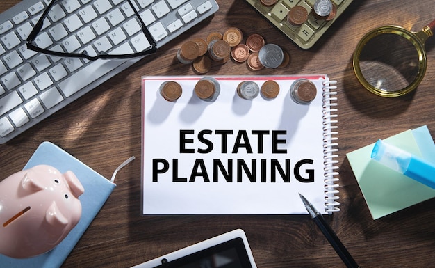 Estate Planning on notepad with a coins and business objects