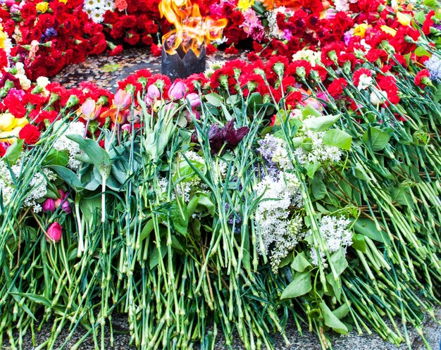 Eternal fire memorial with flowers on may 9 victory day WW II