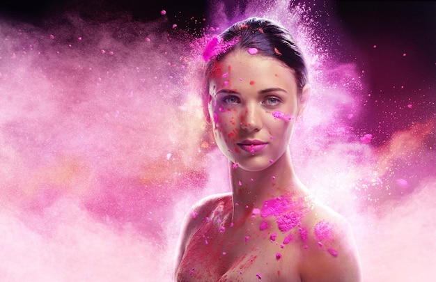 Ethereal beauty Conceptual shot of a beautiful young woman covered in multicolored powder paint