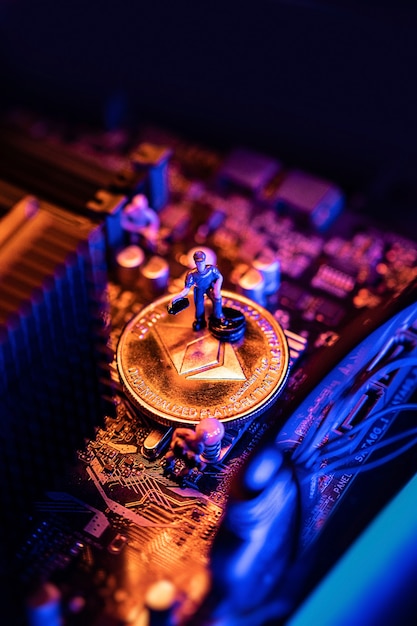 Ethereum Cryptocurrency coin on a PC computer motherboard, crypto currency mining concept.