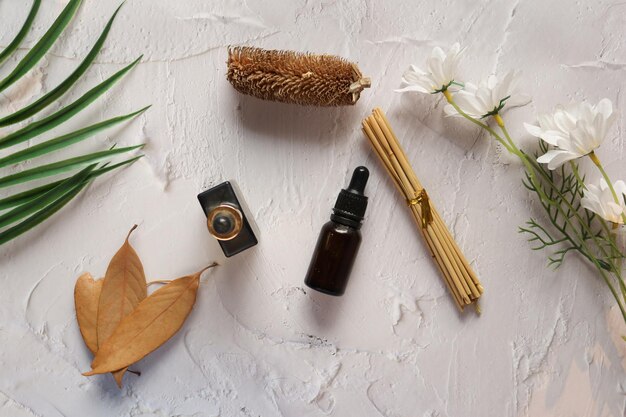 Eucalyptus essential oils in a glass bottle with green leaf on white background