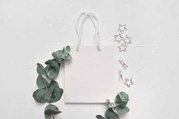 Eucalyptus leaves and white shopping bag