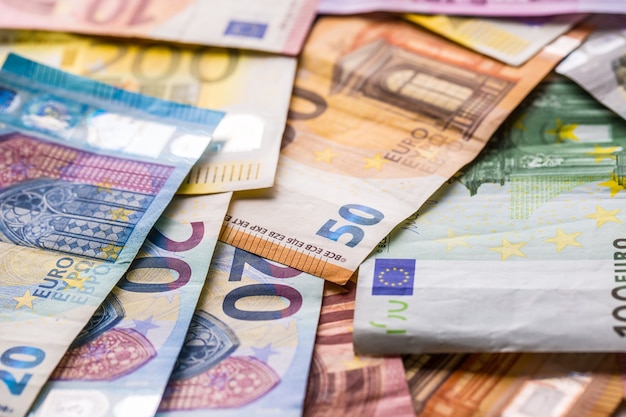 Photo euro banknotes in detail on the pile of other nominal banknotes.