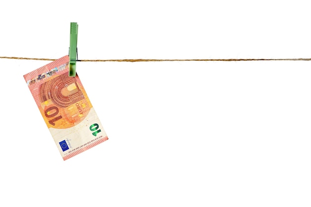 Euro banknotes hanging on a clothesline against white background Money laundering concept