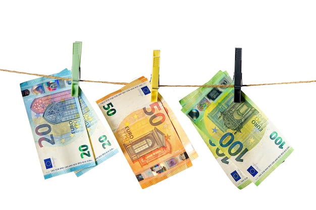 Euro banknotes hanging on a clothesline against white background Money laundering concept