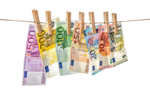 Euro banknotes hanging a rope with clothes pins Money background Selective focus