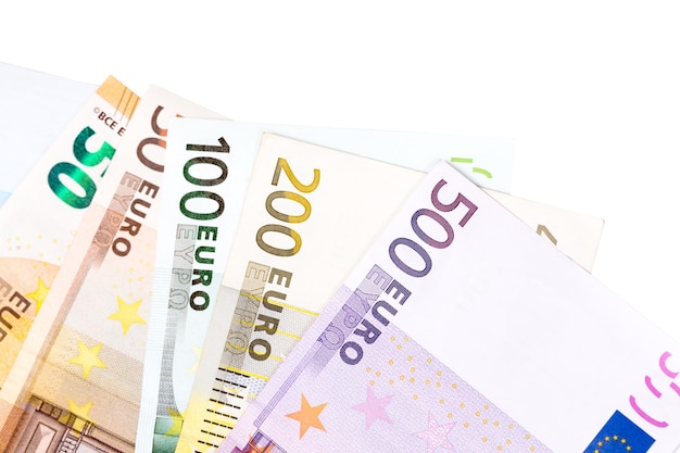 Euro banknotes located on white background close up