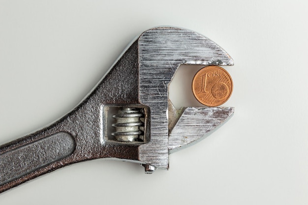 Euro cent clamped in a adjustable wrench