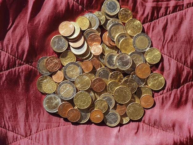 Euro coins European Union over red velvet background