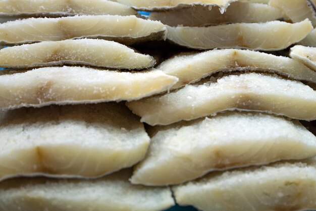 Europe, Spain. Frozen fish fillets in the market of Barcelona