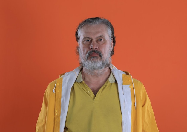 european bearded old man in yellow clothes