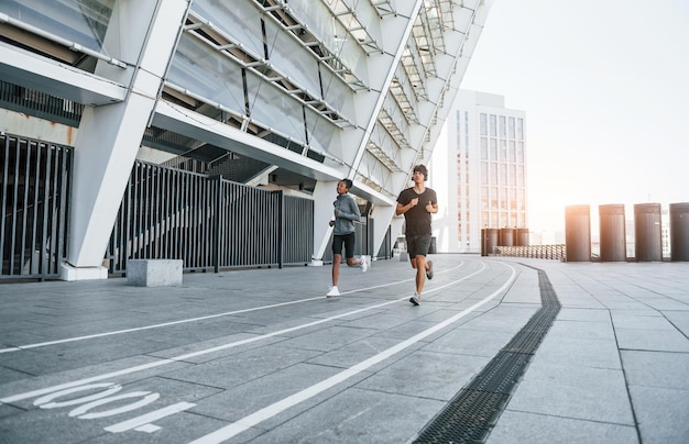 European man and african american woman in sportive clothes have workout together