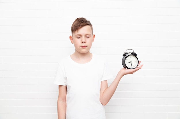 European teenager with an alarm clock