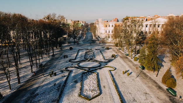 European town Poltava in Ukraine. Snowy central park of the city, land design, old cadet corp. High quality photo