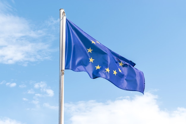 European Union flag on blue sky background