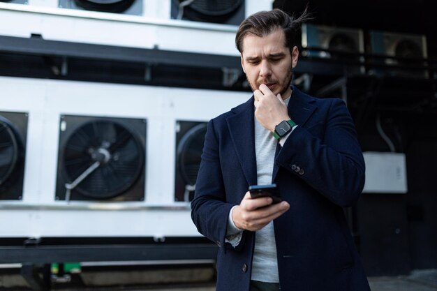 European young businessman on the background of the business center