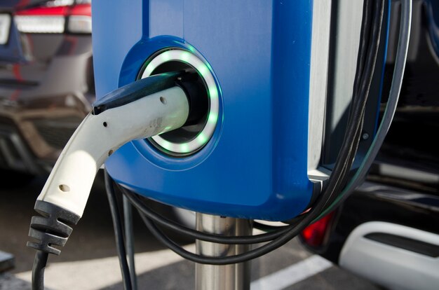 EV Car or Electric vehicle at charging station cable