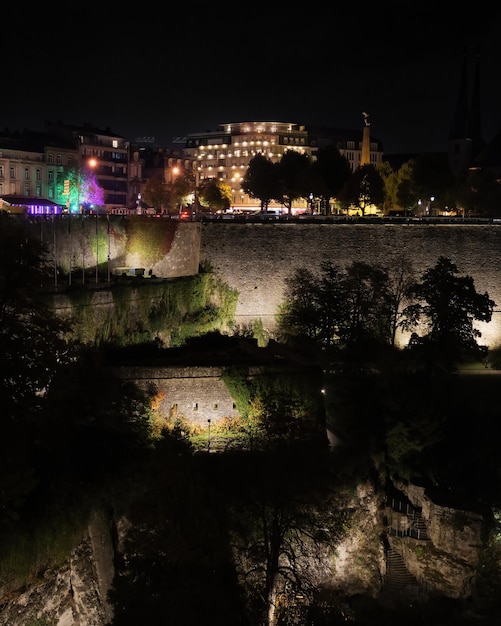 Evening city building and illuminated castle ruins