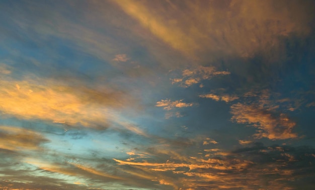 Evening dusk sky orange clouds with blue sky background