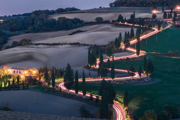 Evening landscapes of Tuscany with traces of car headlights