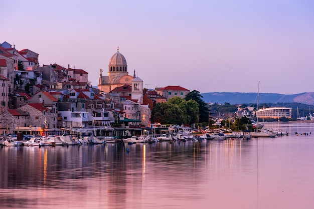 Evening Sibenik city in Croatia night city lights reflection cityscape