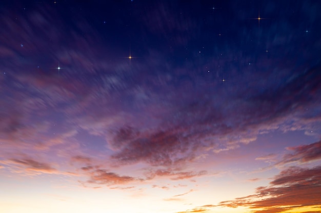 Evening sky day turns to night Sunset clouds and starry sky