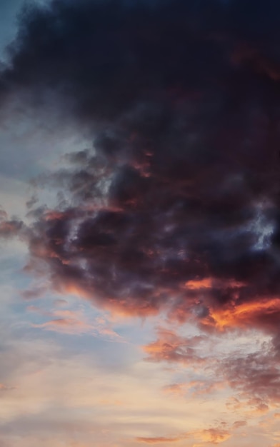 Evening sky with dark clouds illuminated with sun panorama