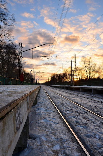 Evening winter landscape with the railway station