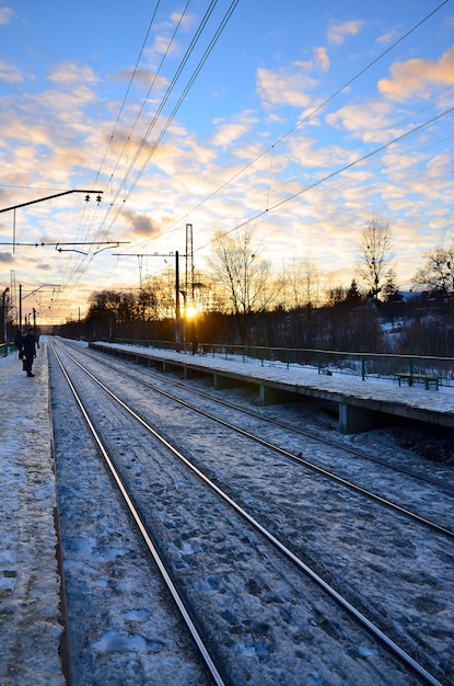 Evening winter landscape with the railway station