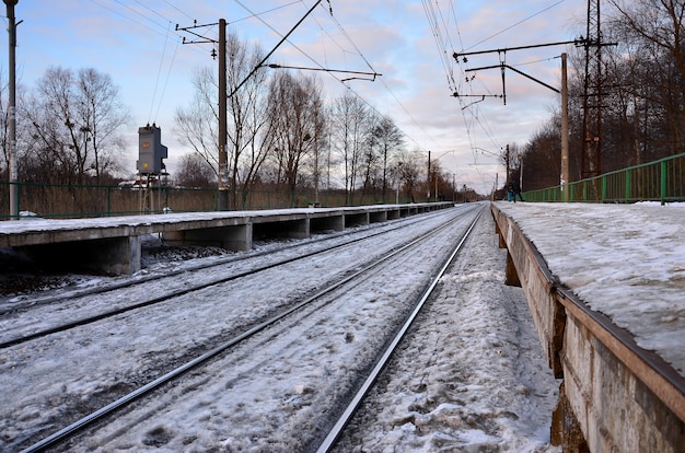 Evening winter landscape with the railway station