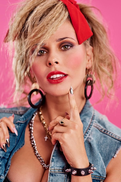 Everyone looked like a rockstar in the 80s Studio shot of a beautiful young woman wearing a 80s outfit