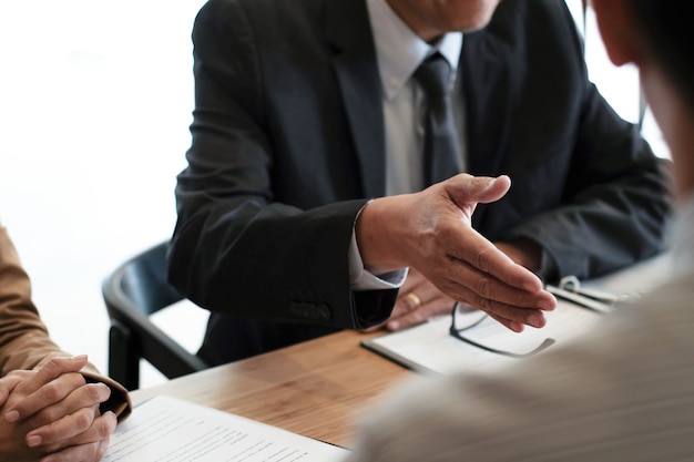 Examiner reading a resume during job interview at office Business and human resources concept.