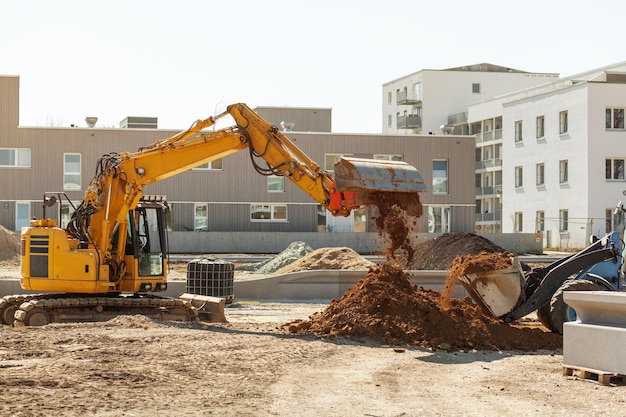 Excavator Working on Construction Site Crawler Excavator Throws Ground on pile on Urban Place